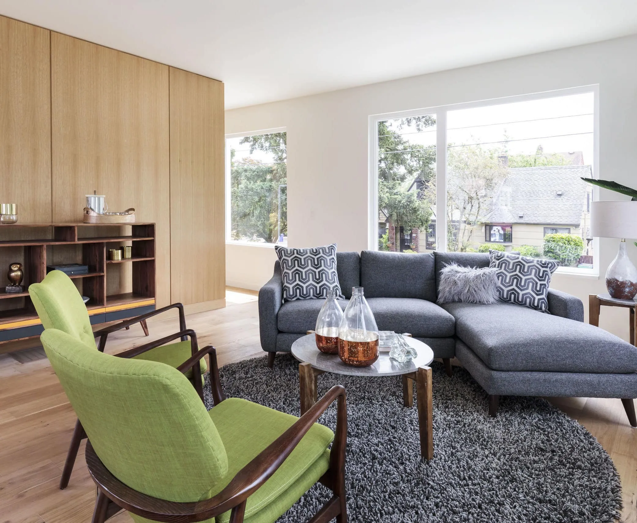 A living room filled with furniture and a large window