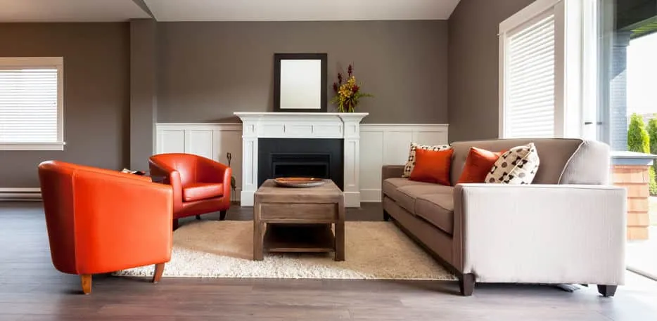 A living room filled with furniture and a large window