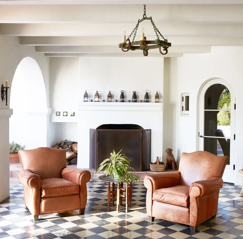 A living room filled with furniture and a fire place