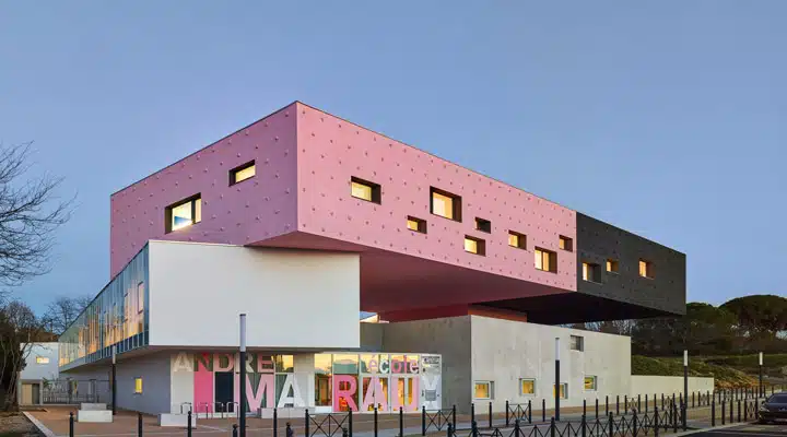 A group of people standing in front of a building