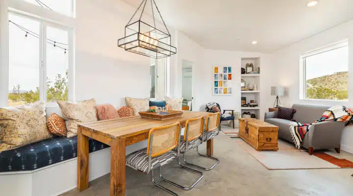 A living room filled with furniture and a large window