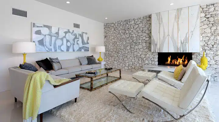 A living room filled with furniture and a fireplace