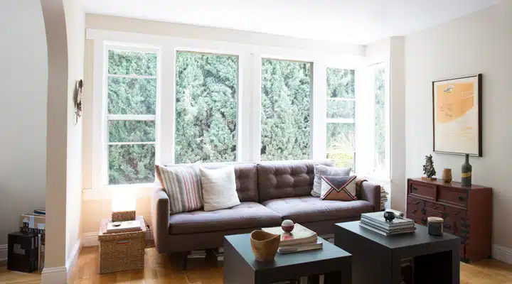 A living room filled with furniture and a fire place