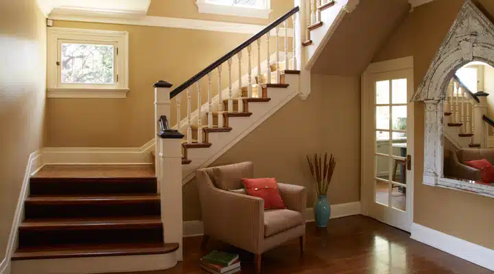 A view of a living room filled with furniture and a large window