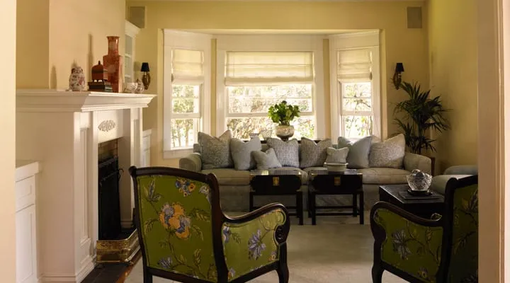 A living room filled with furniture and a large window