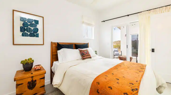 A bedroom with a large bed in a hotel room