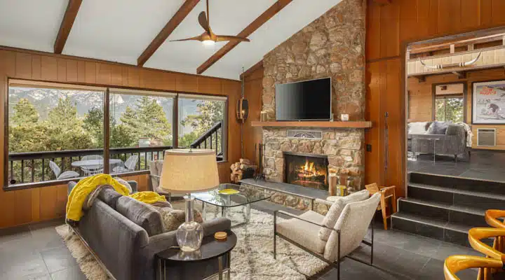 A living room filled with furniture and a fire place