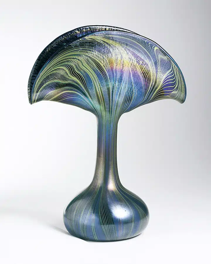 A glass with a blue vase