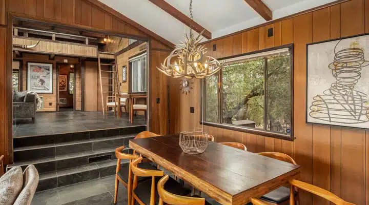 A dining room table in front of a window