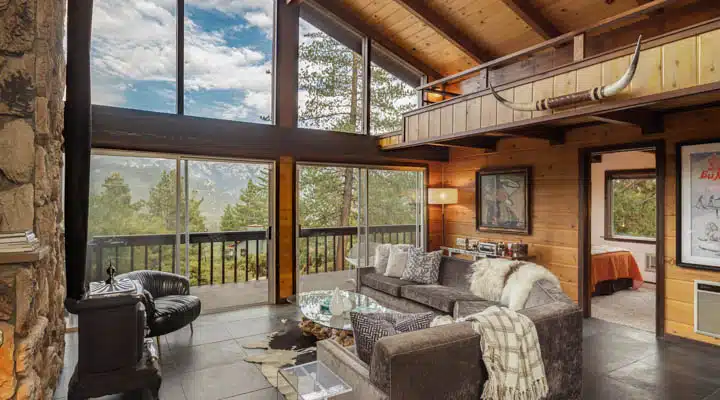 A living room filled with furniture and a large window