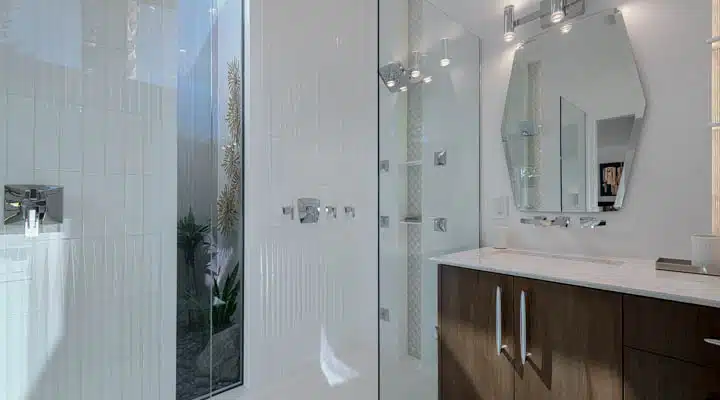 A room with a sink and a mirror