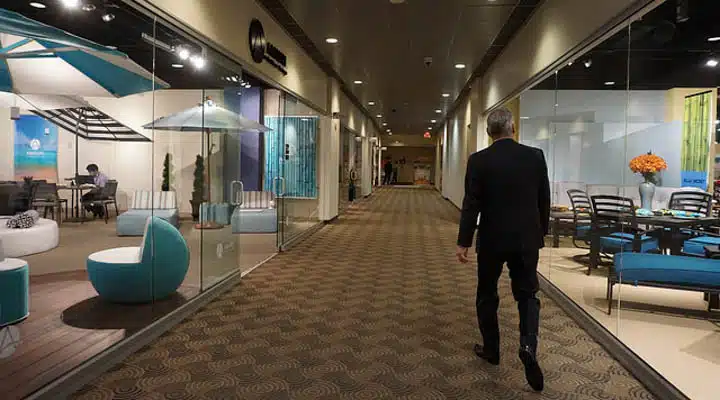 A man standing in front of a store