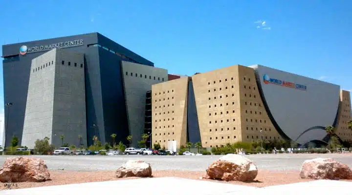 A person sitting in front of a building