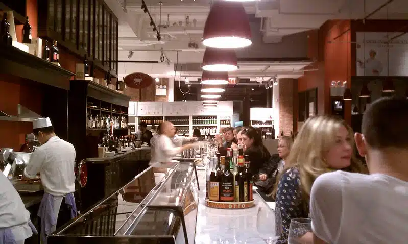 A group of people preparing food in a kitchen