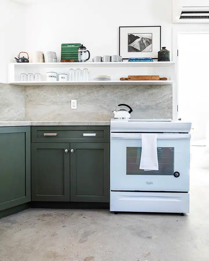 A kitchen with a stove top oven sitting inside of a refrigerator