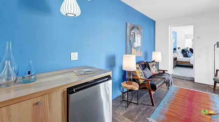 A living room filled with furniture and a wood floor