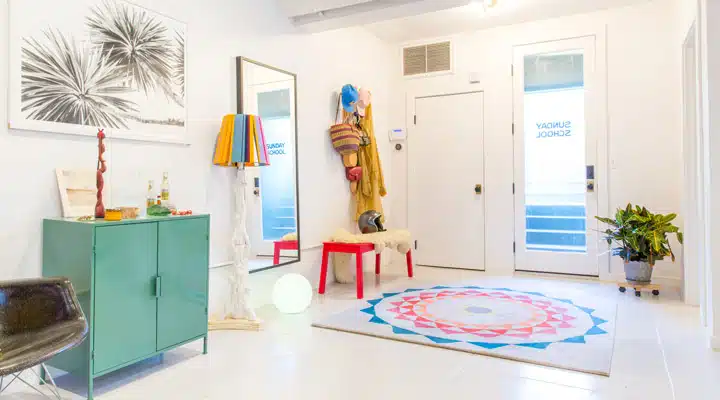 A bedroom with a large mirror