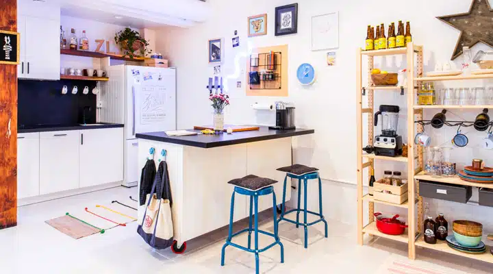 A kitchen with a table in a room