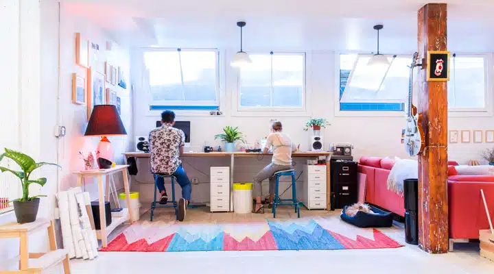 A desk with a computer on a table
