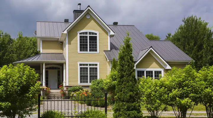 A house with trees in the background