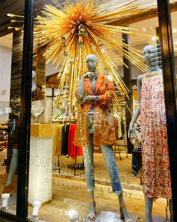 A person standing in front of a store
