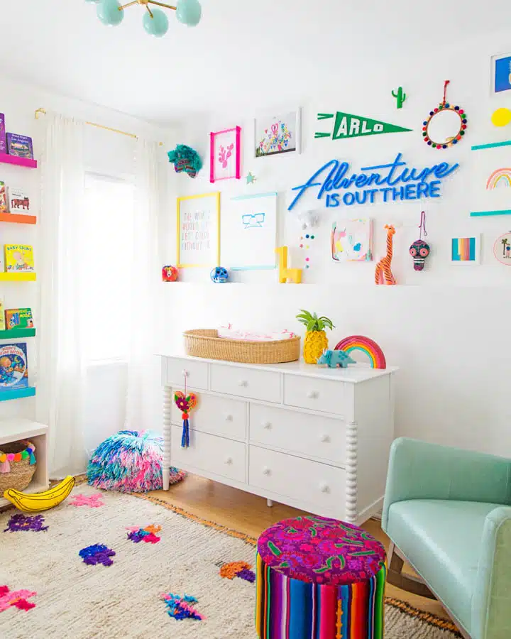 A bedroom with a bed and desk in a small room