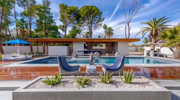 A pool next to a palm tree on a table