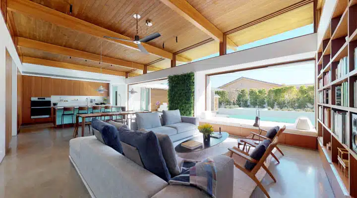 A living room filled with furniture and a large window