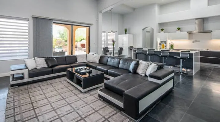 A living room filled with furniture and a large window