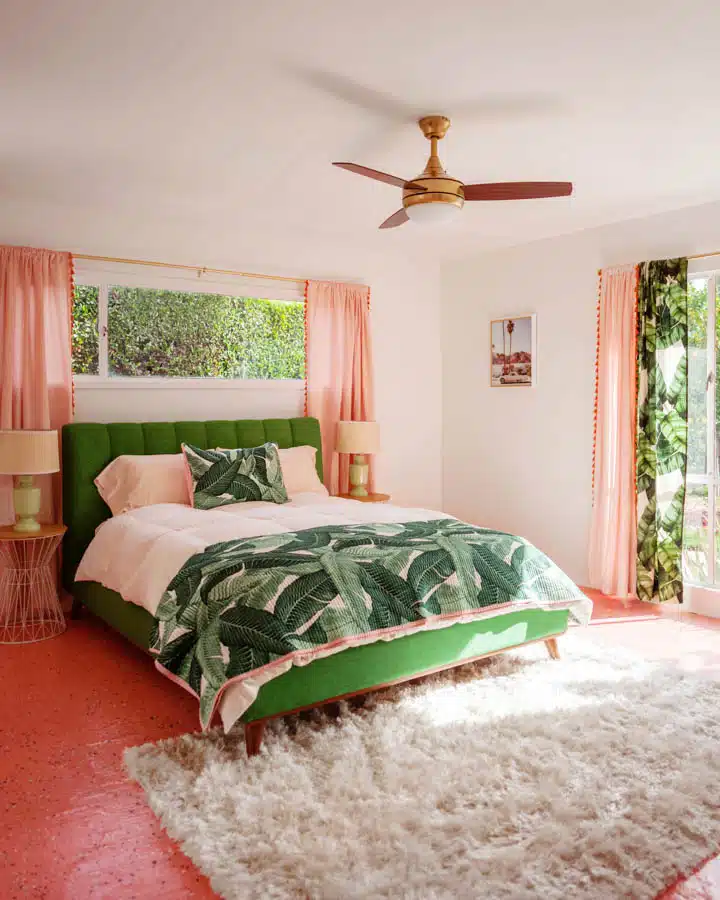 A bedroom with a bed in a room