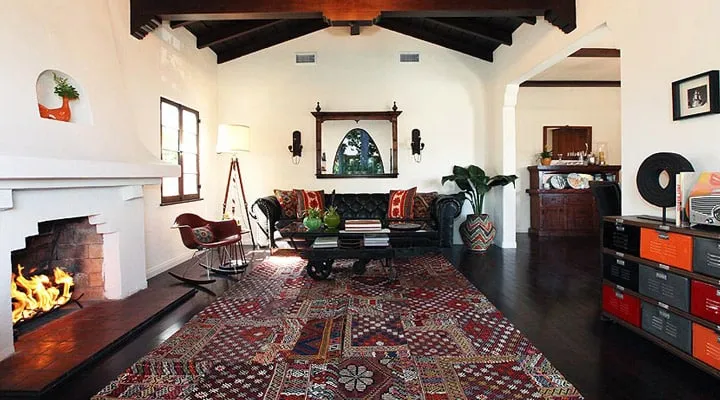 A living room filled with furniture and a fire place