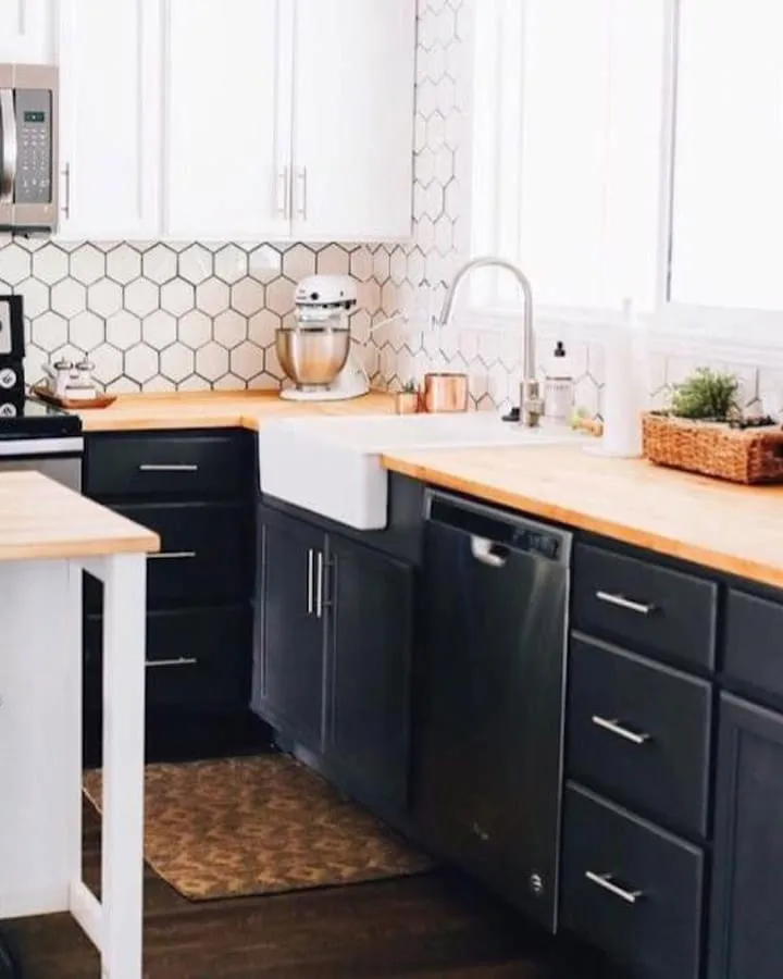 A modern kitchen with stainless steel appliances and wooden cabinets