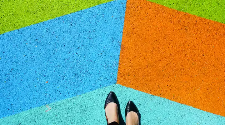 A person standing on a sidewalk