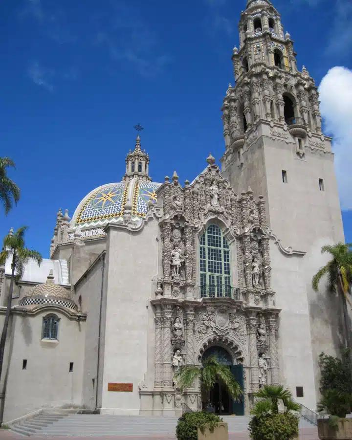 A large stone statue in front of a church