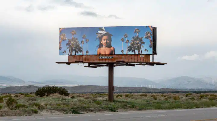 A sign on the side of a road