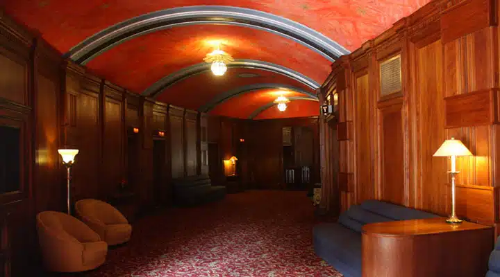 A bedroom with a large bed in a hotel room