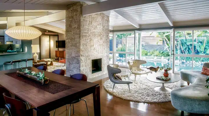 A dining room table in front of a window