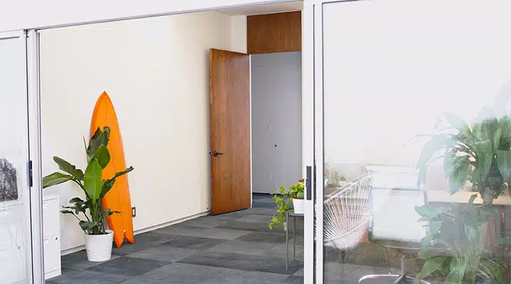 A kitchen with a refrigerator and a window