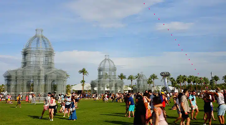 A group of people flying kites in a field