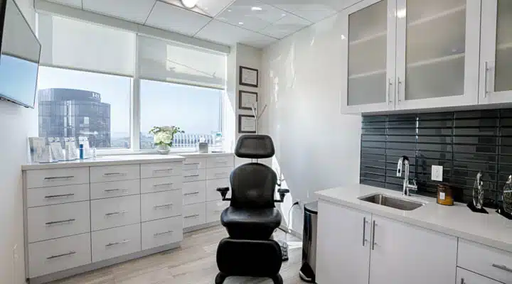 A kitchen with a sink and a window