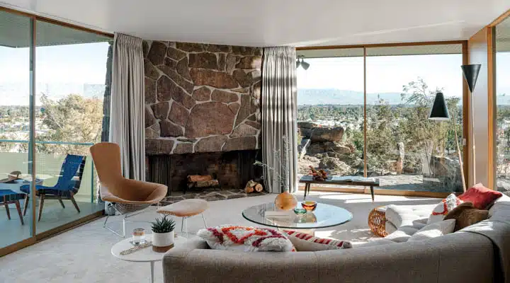 A living room filled with furniture and a fire place