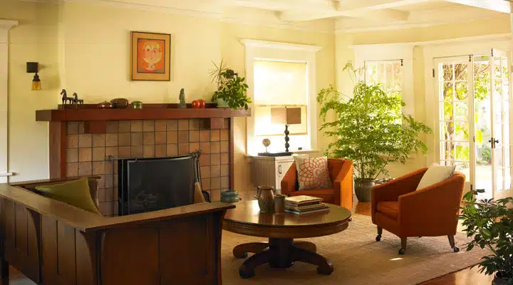 A living room filled with furniture and a fire place