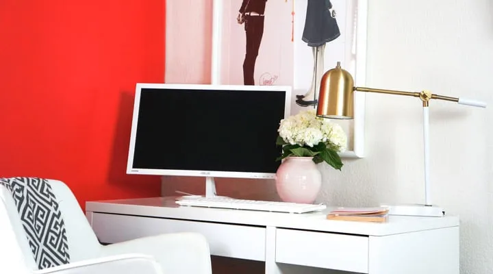 A living room with a sink and a mirror