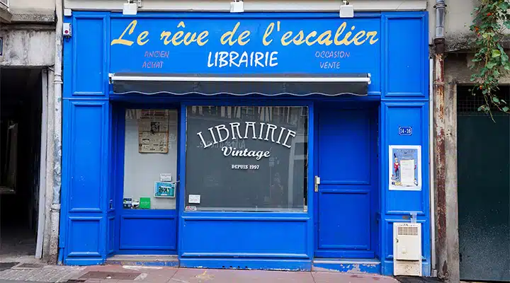 A store front with a blue door