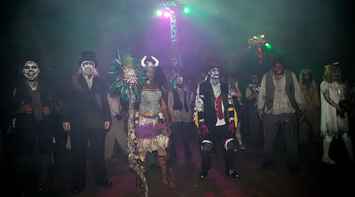 A group of people standing on a stage posing for the camera