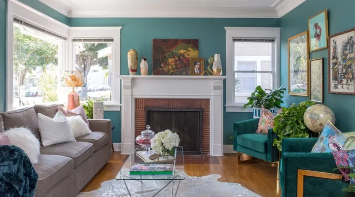 A living room filled with furniture and a fire place