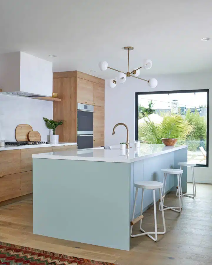 A kitchen with an island in the middle of a room