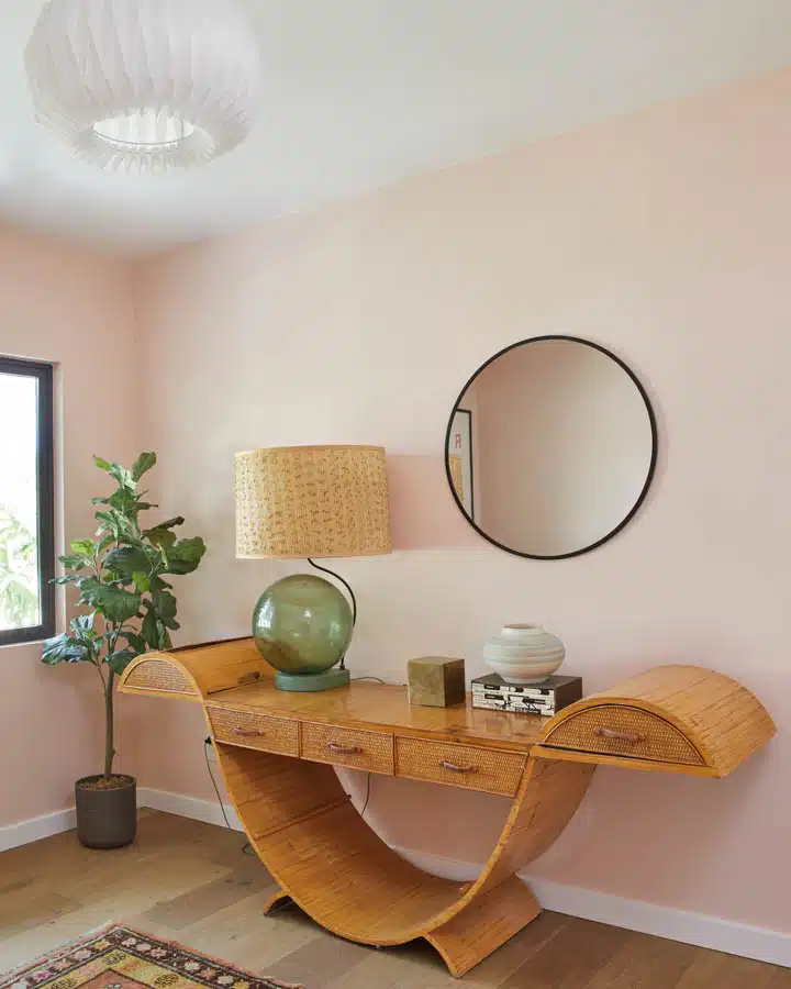 A desk with a laptop in a room