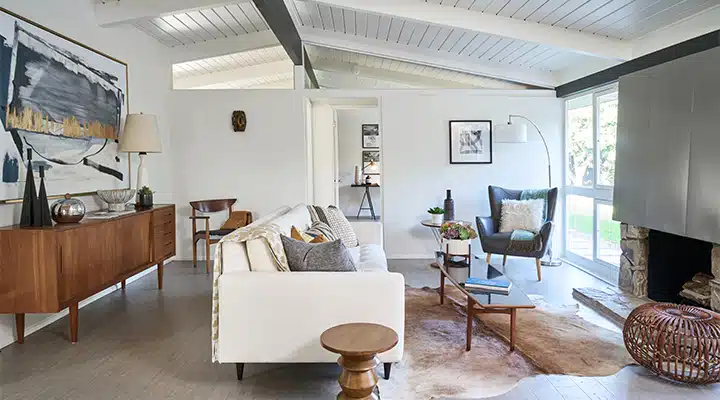 A living room filled with furniture and a large window