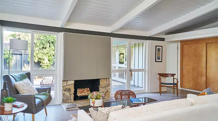 A living room filled with furniture and a large window